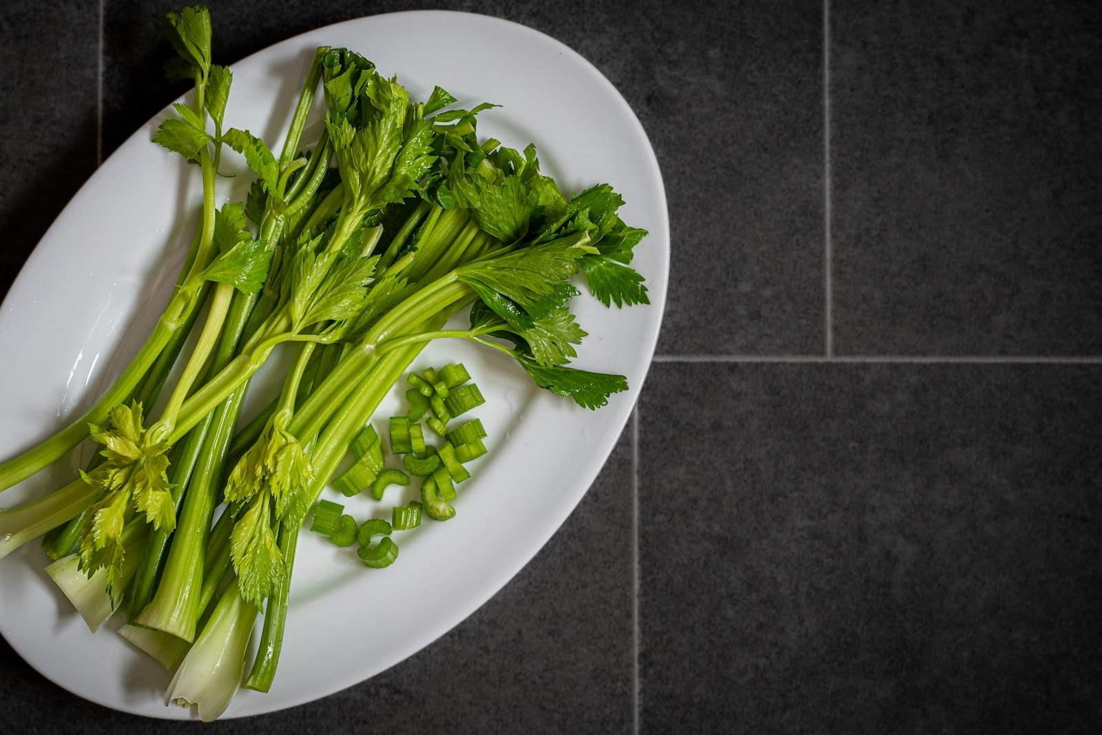 Plate of leafy green vegetables — a diet lower in refined carbohydrates is first-line treatment for PCOS